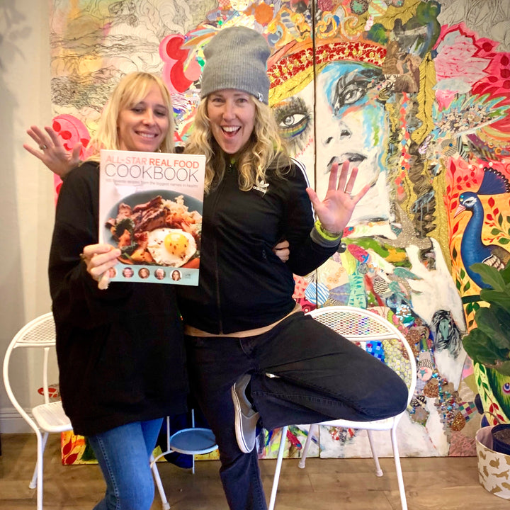 Ascb two women smiling with all star real food cookbook.