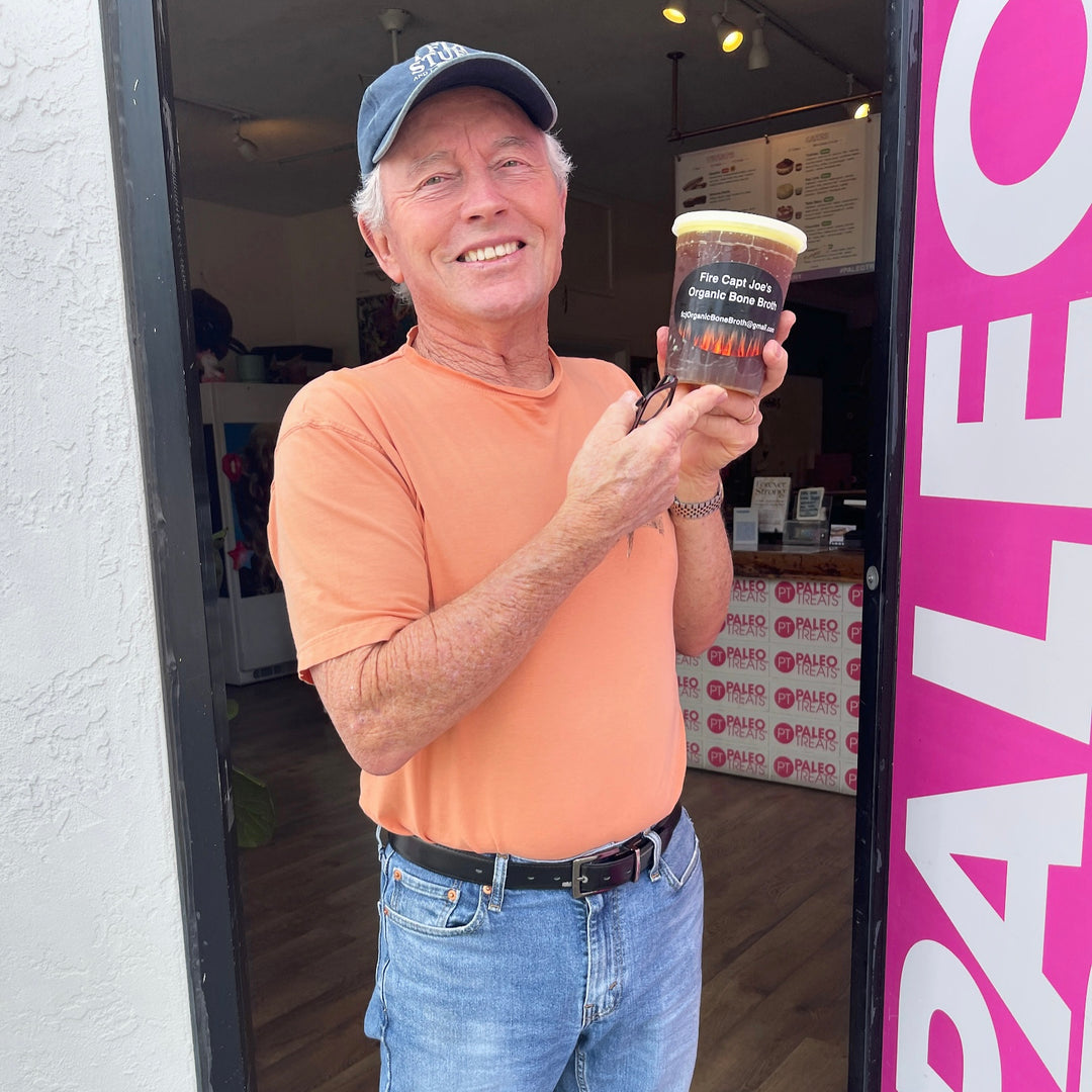 Bone broth man holding up bone broth tub at paleo treats store on adams ave.