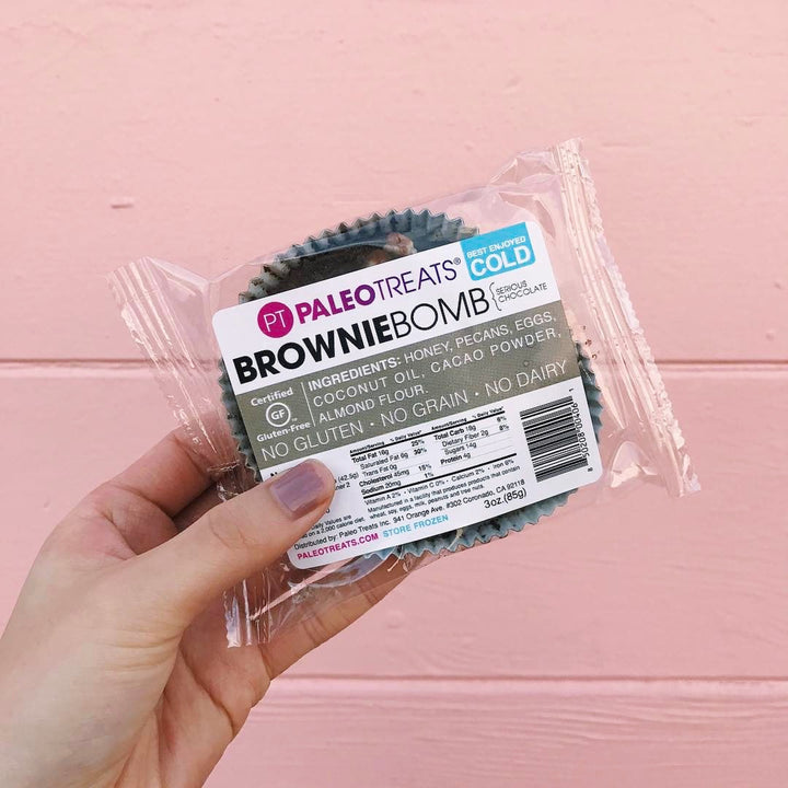 Brownie bomb hand holding single gluten free brownie.
