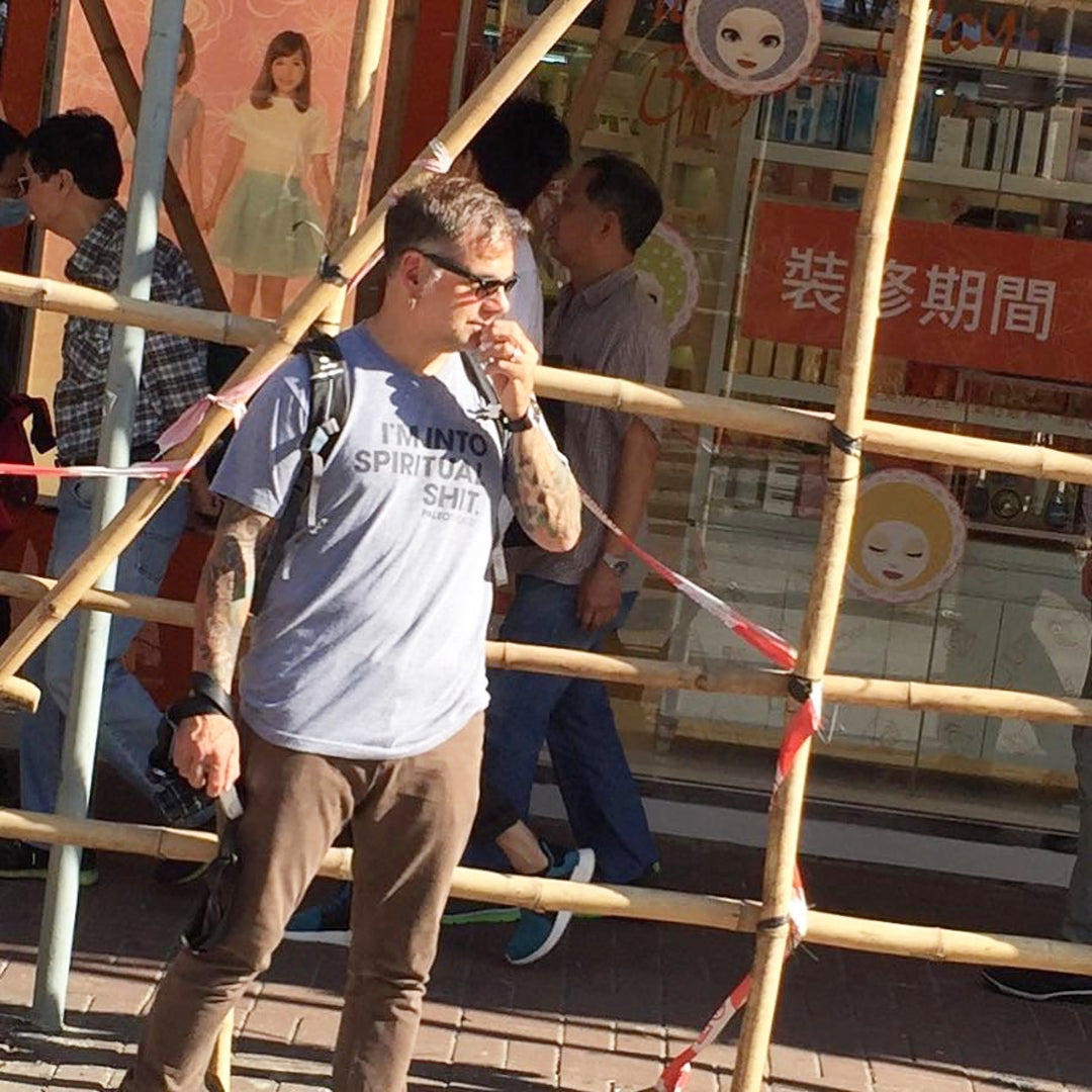 Man wearing spiritual shit shirt in asia.