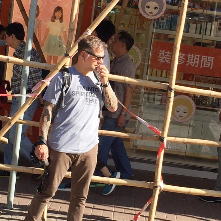 Man wearing spiritual shit shirt in asia.