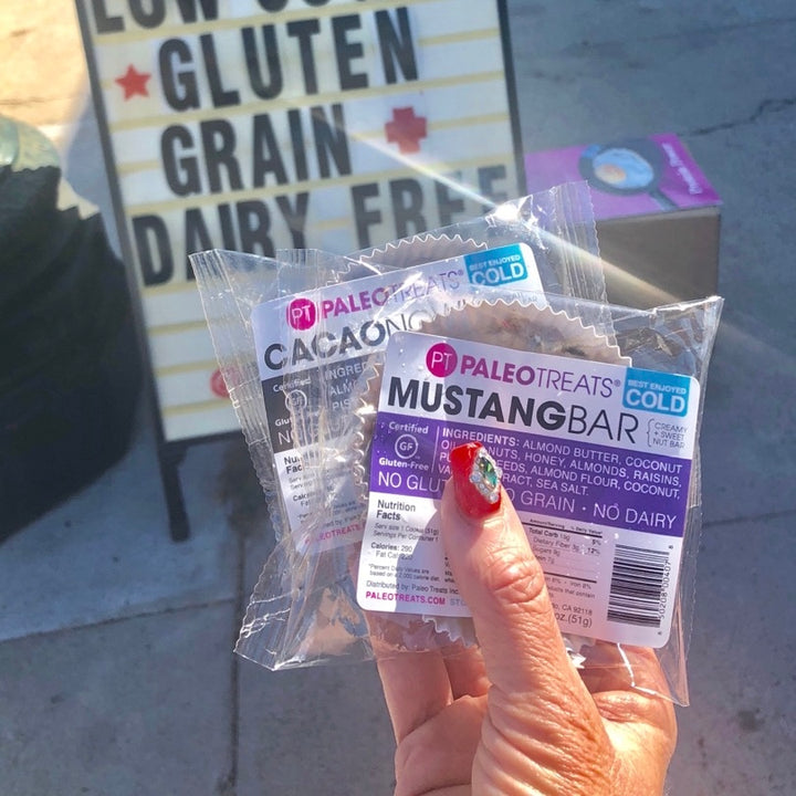 Mustang held by womans hand prepackaged gluten free snack.