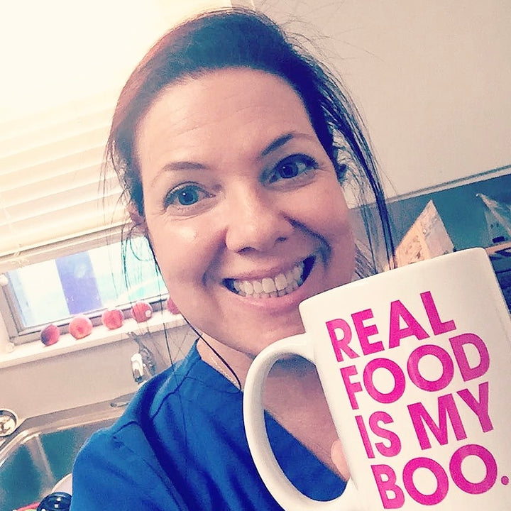 Mustang real food is my boo mug smiling woman ready for paleo snacks.