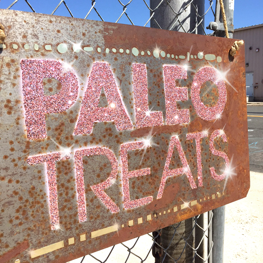 Paleo treats sign in barrio logan covered in pink glitter.
