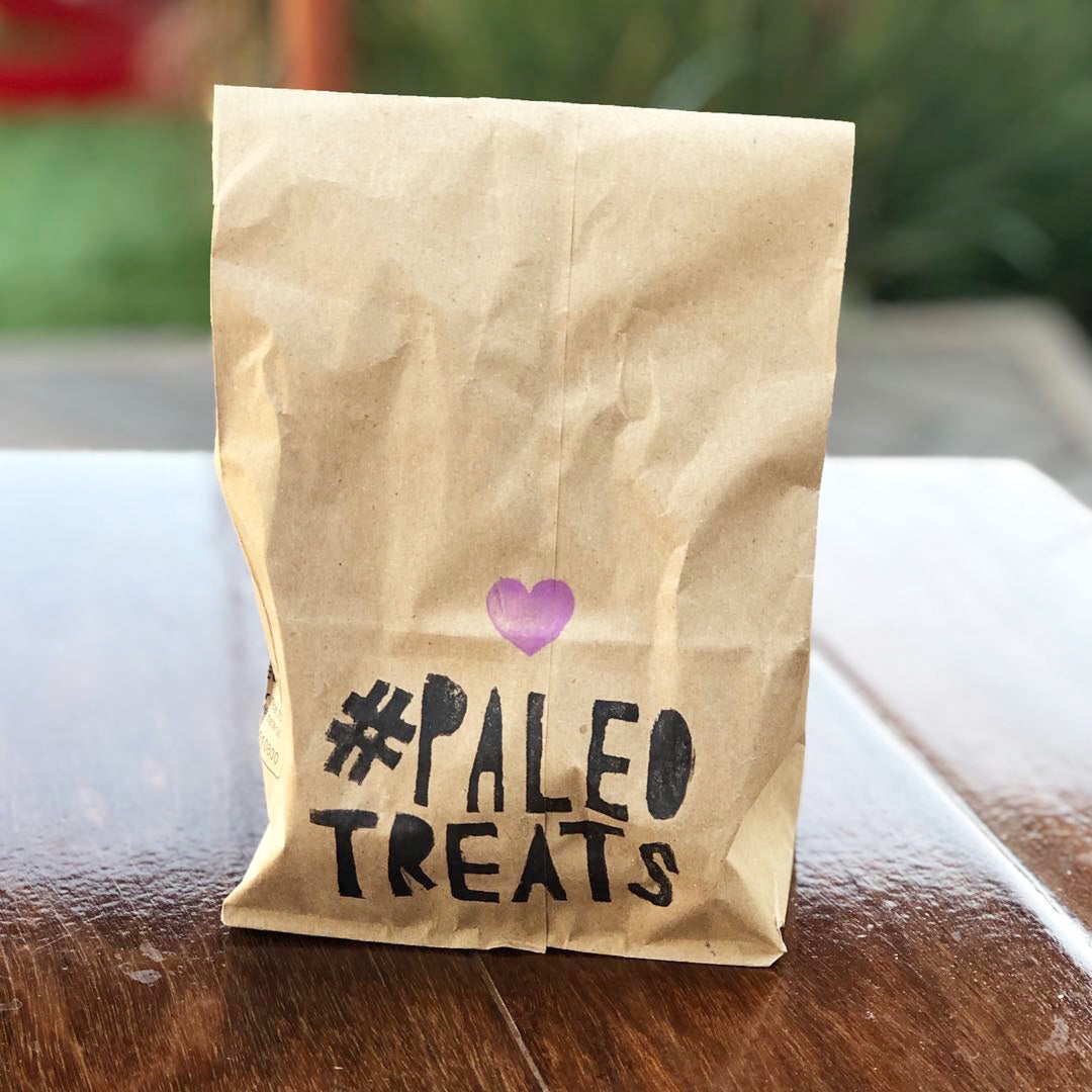 Protein keto donuts to go in a bag by Paleo Treats.