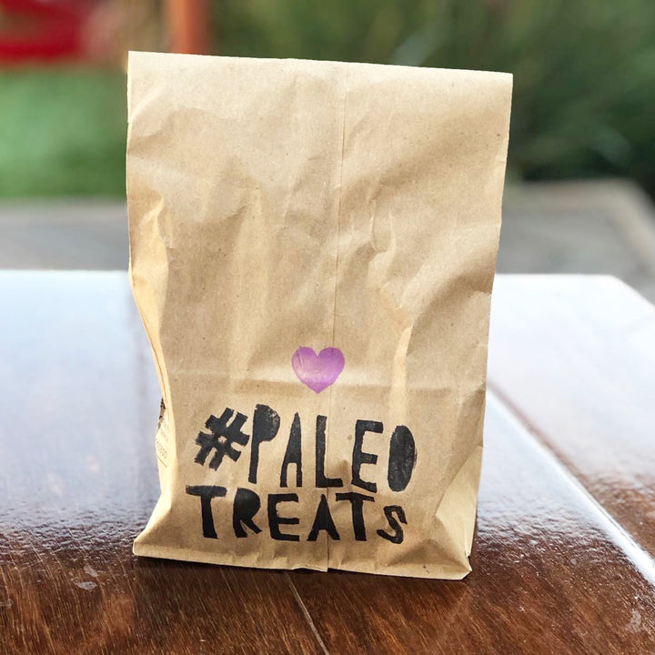 Protein keto donuts to go in a bag by Paleo Treats.
