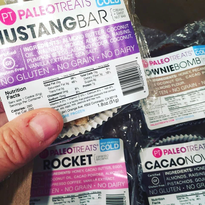 Sampler held above other paleo treats dairy free desserts.