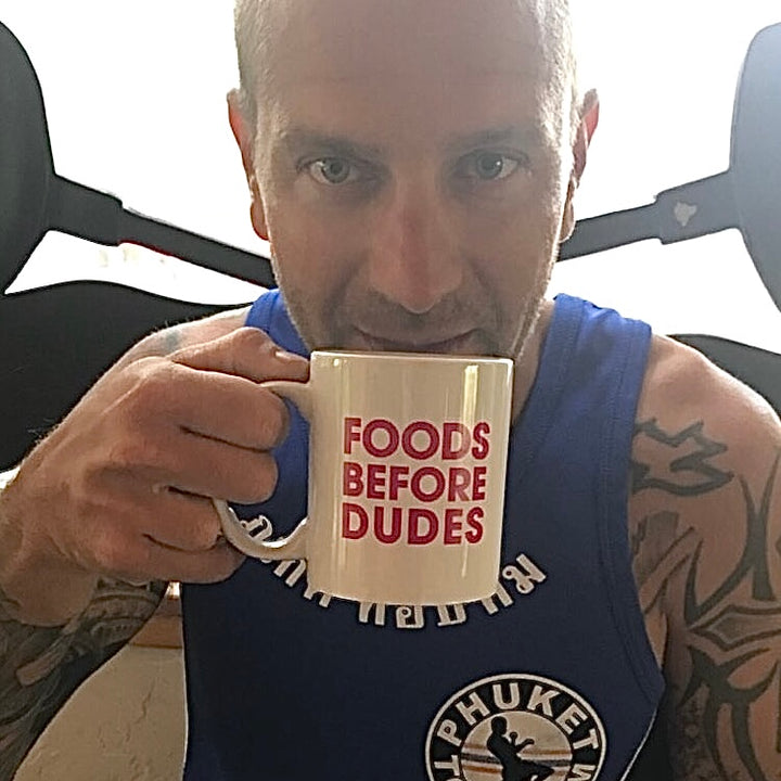 Small stack sampler man smiles as he sips from foods before dudes mug loves paleo treats.