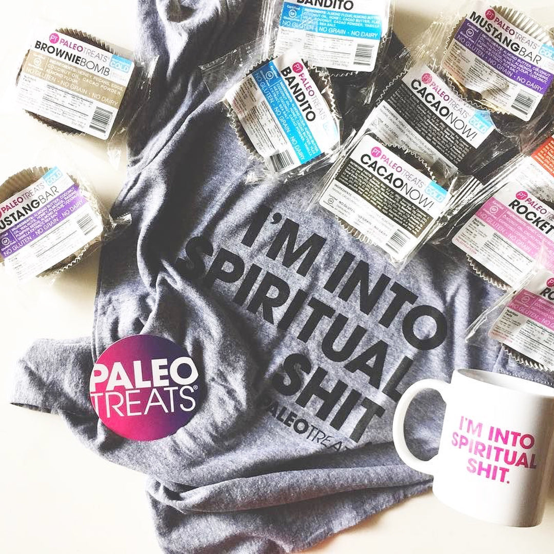 Spiritual shirt shirt surrounded by paleo treats mugs and stickers.
