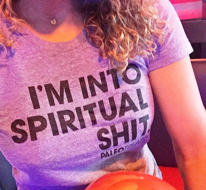 Woman wearing im into spiritual shit t shirt.